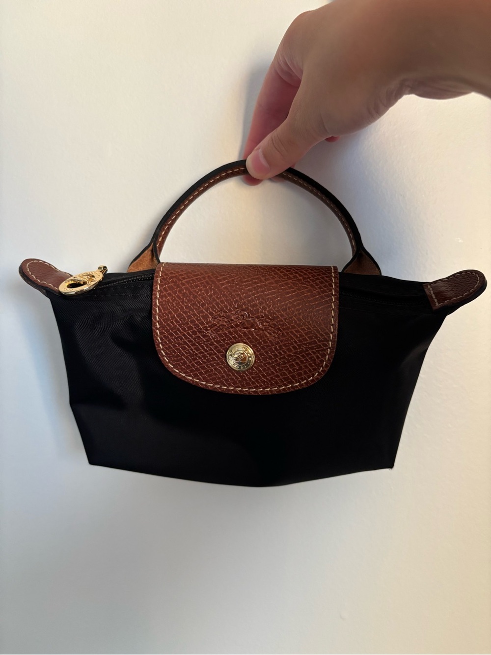 Longchamp Le Pliage Mini black nylon top-handle bag with brown leather trim
